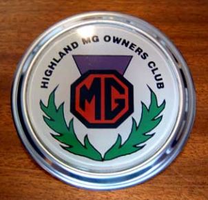 For the benefit of recently-joined members the badge, as shown in this photo, is enamelled onto a disc of chromed metal and is available in either Bar Mounting or Grill Mounting format. The price remains unchanged at £10 each. 